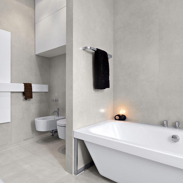 Tiled bathroom with bathtub, toilet, and bidet Tiled bathroom with bathtub, toilet, and bidet